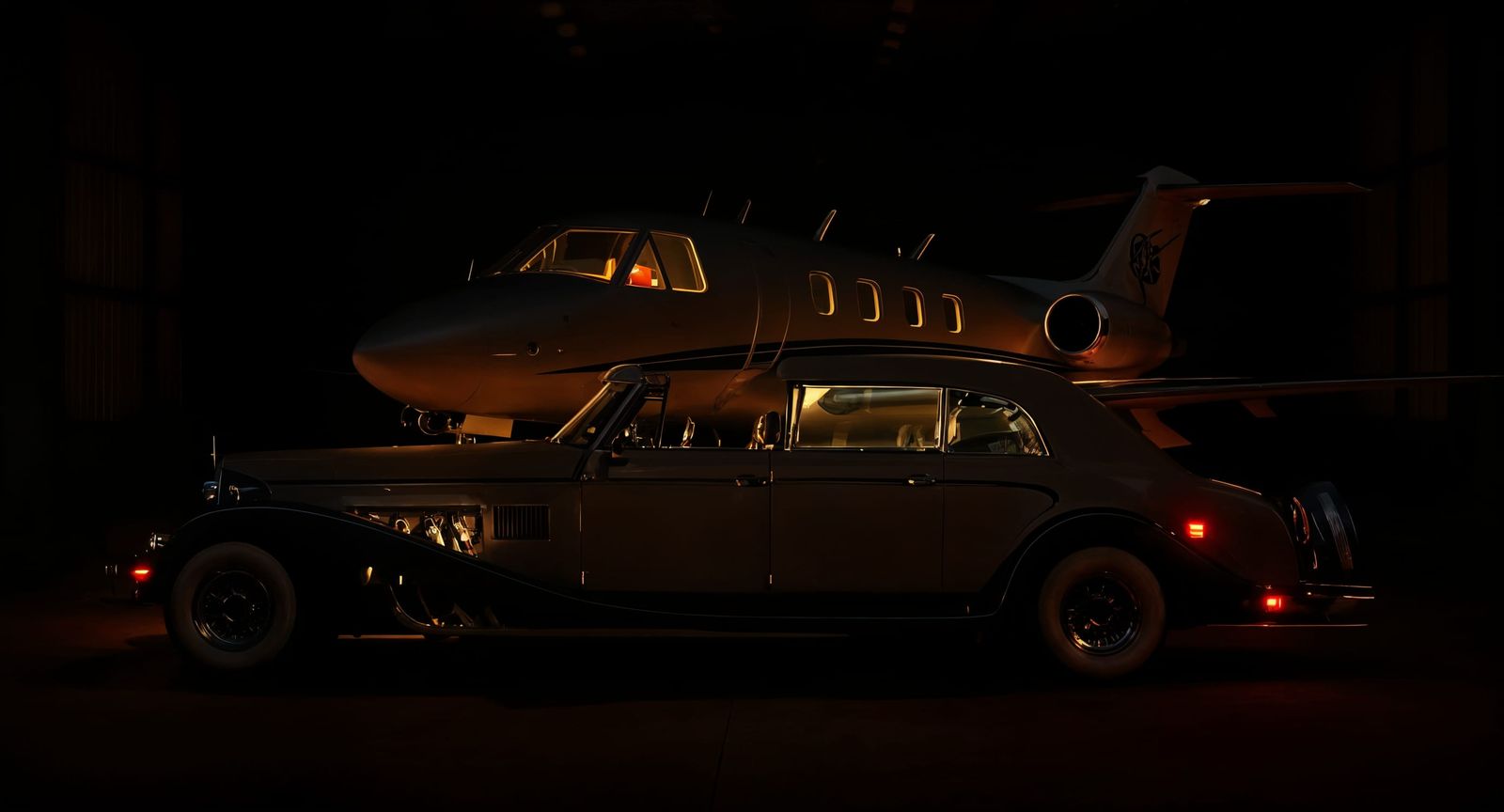 Luxury Car Parked Beside Private Jet in Hangar