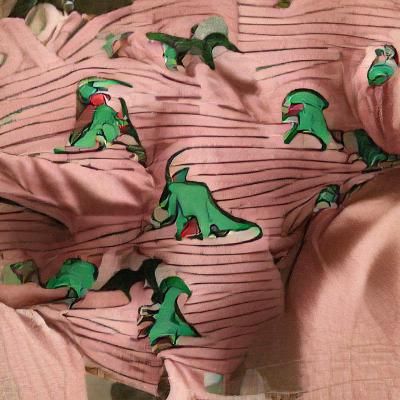 Prehistoric Creatures Wear Cozy Pajamas in a Fantastical Sce...