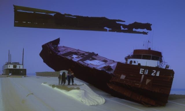 Historic Shipwreck on a Serene Lake Shore