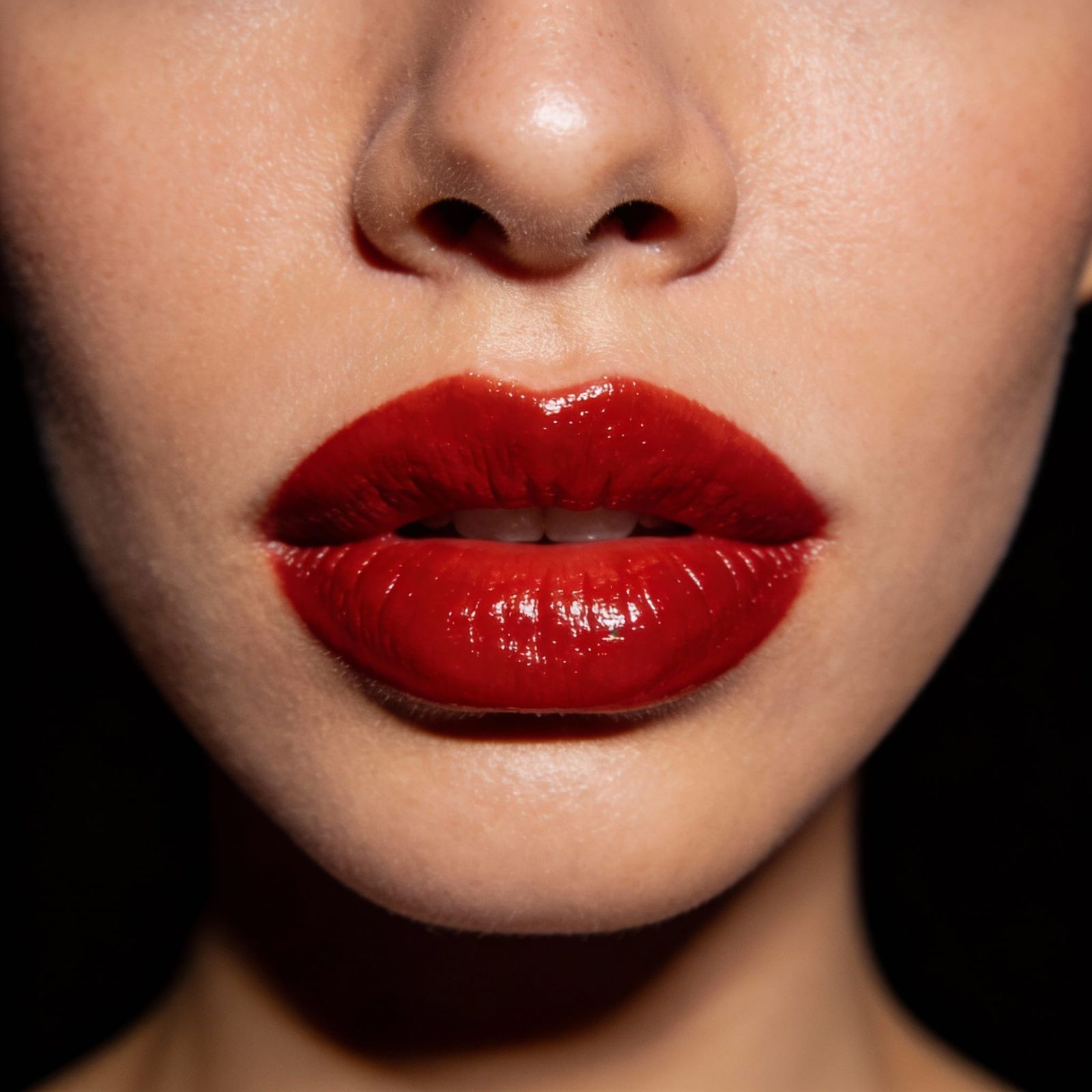 Striking Red Lips Against Black Background