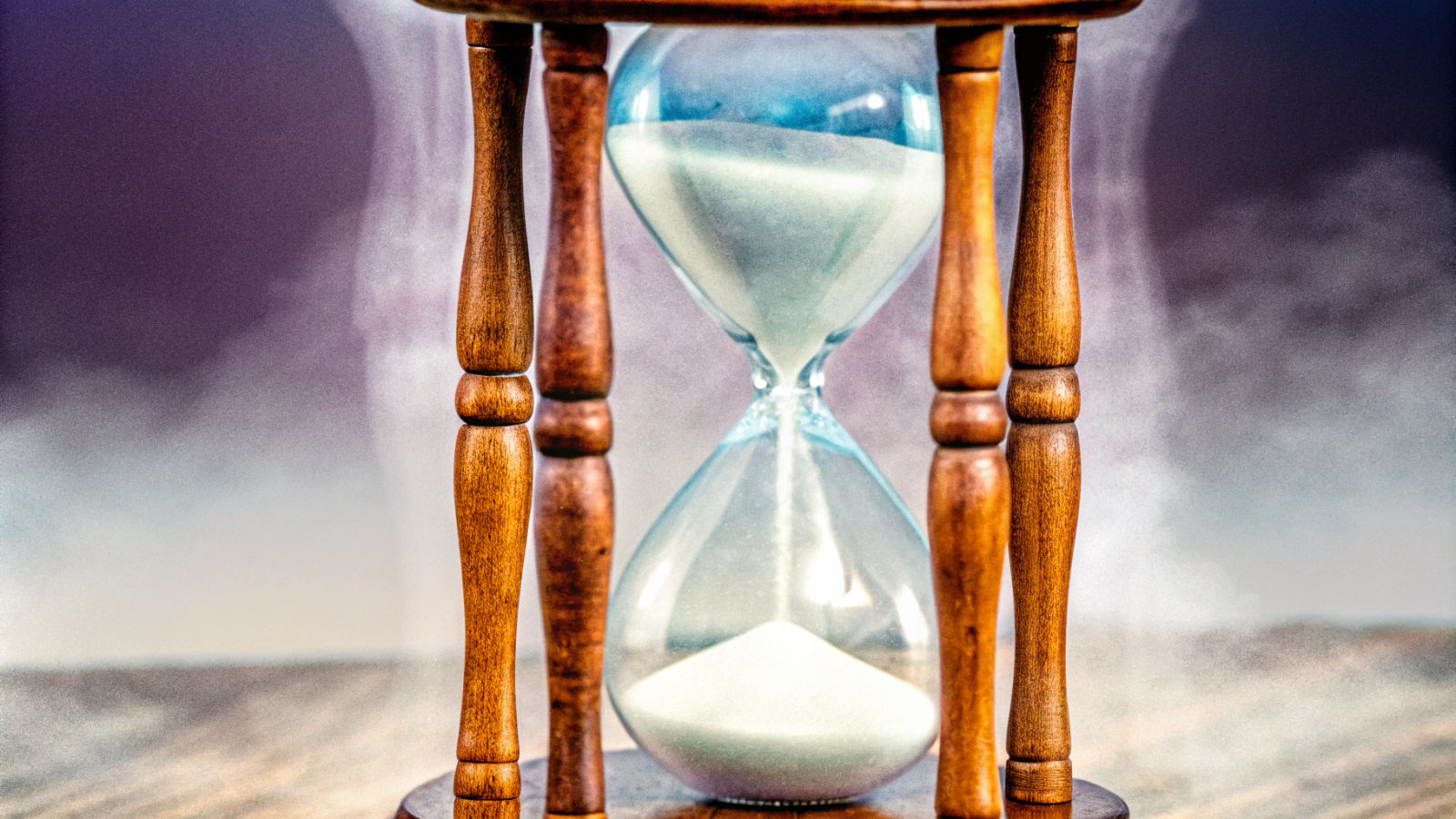 Ethereal Hourglass with Swirling, Misty Sand