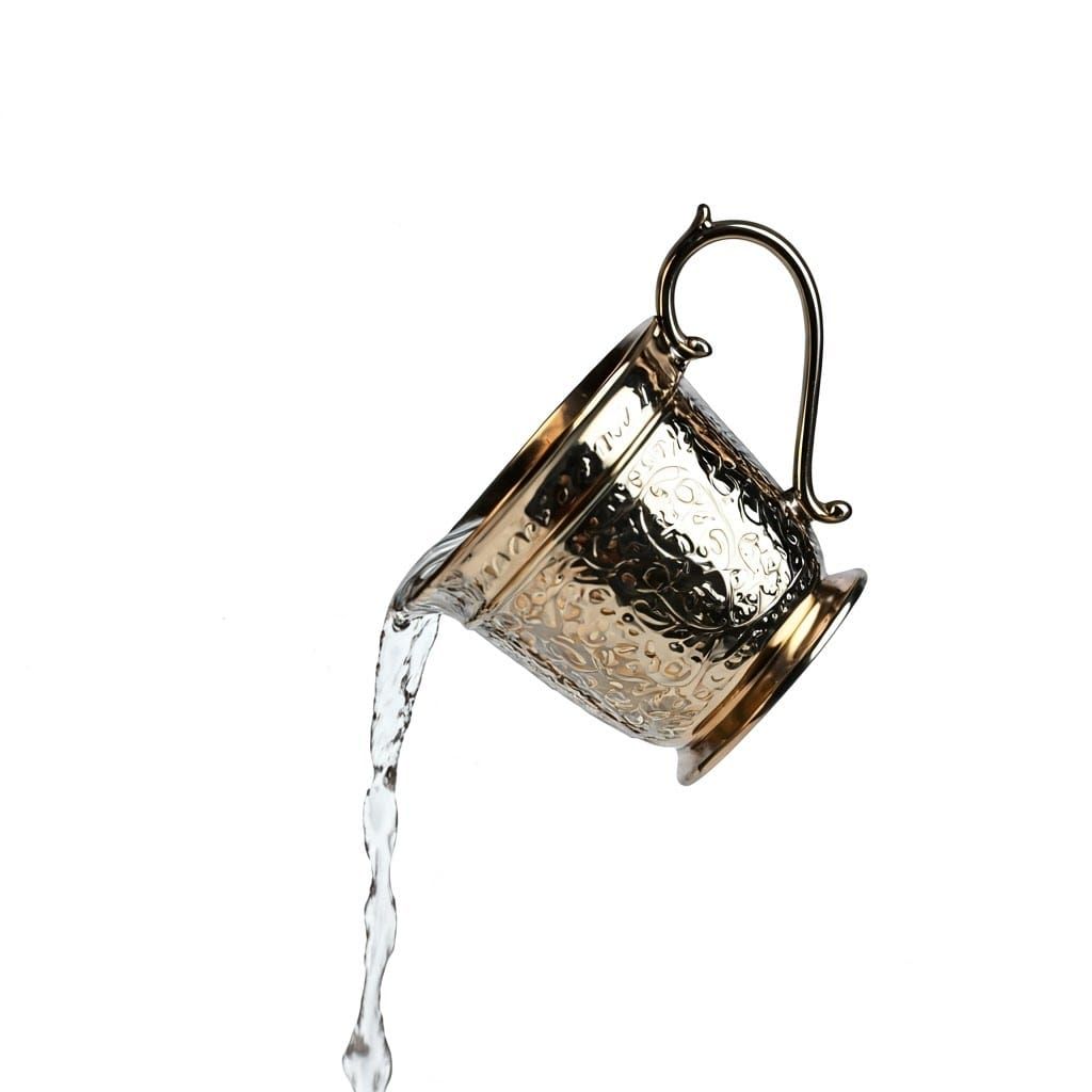 Elegant Silver-Gold Hand Washing Cup in Action