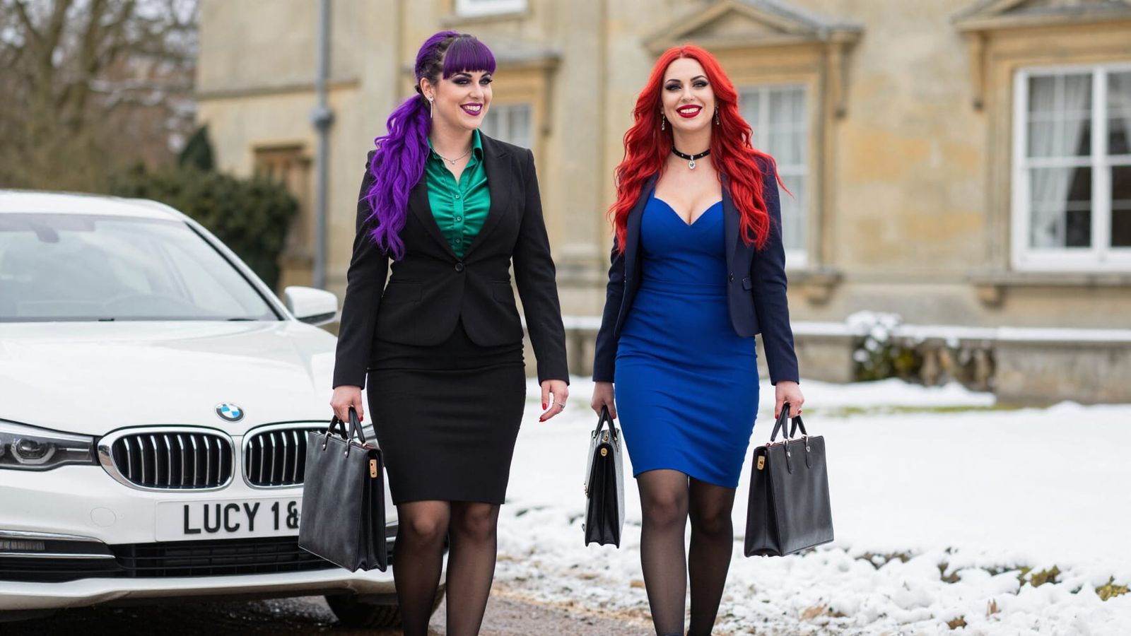 Stylish Businesswomen with BMW at Snowy Mansion