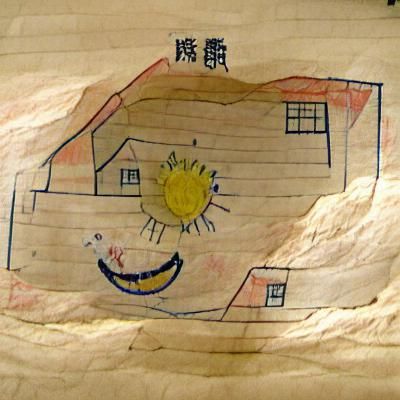 Child's Drawing of a House with Smiling Sun