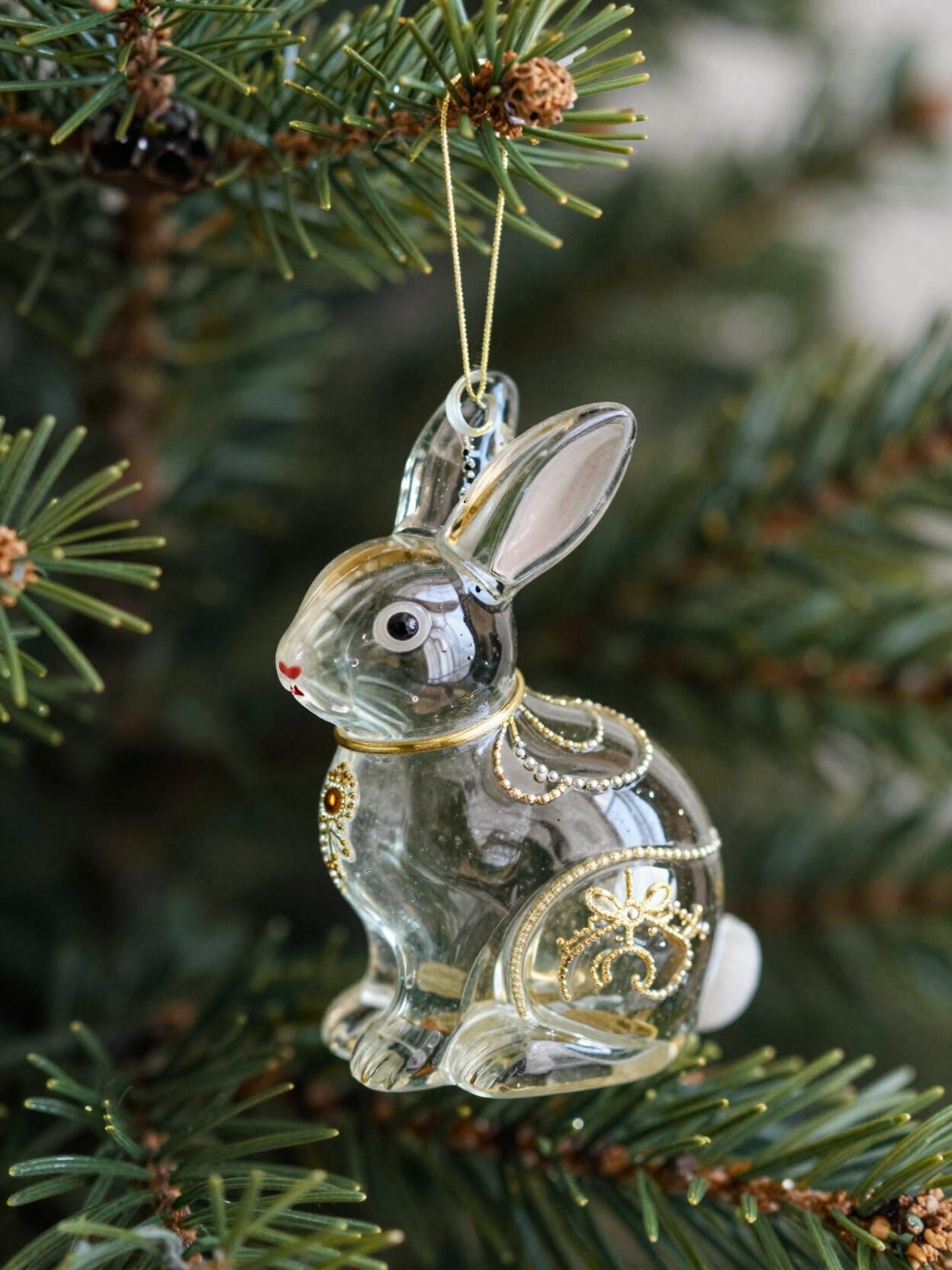 Ornate Glass Rabbit Ornament on Fir Tree Branch