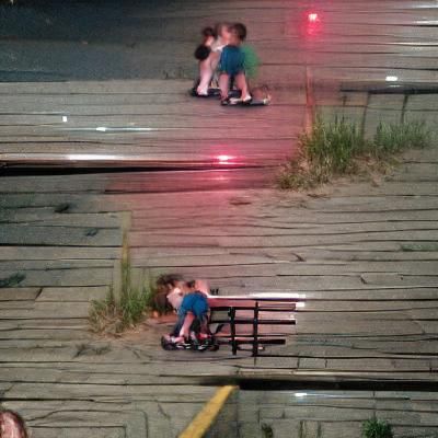 Lonely Boardwalk Figure, Kissing Children
