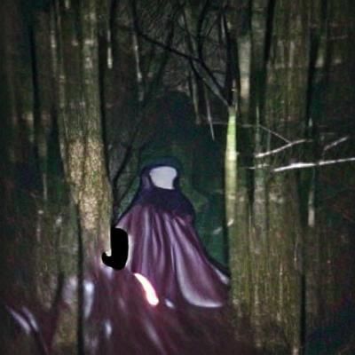Mysterious Figure in Dark Forest