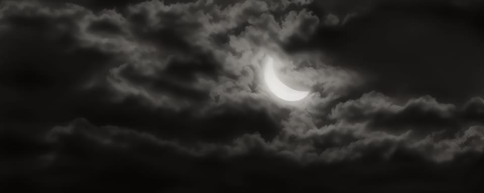 Detailed Crescent Moon in Black and White Night Sky
