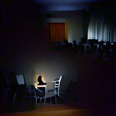 Solitary Woman in Dark Room