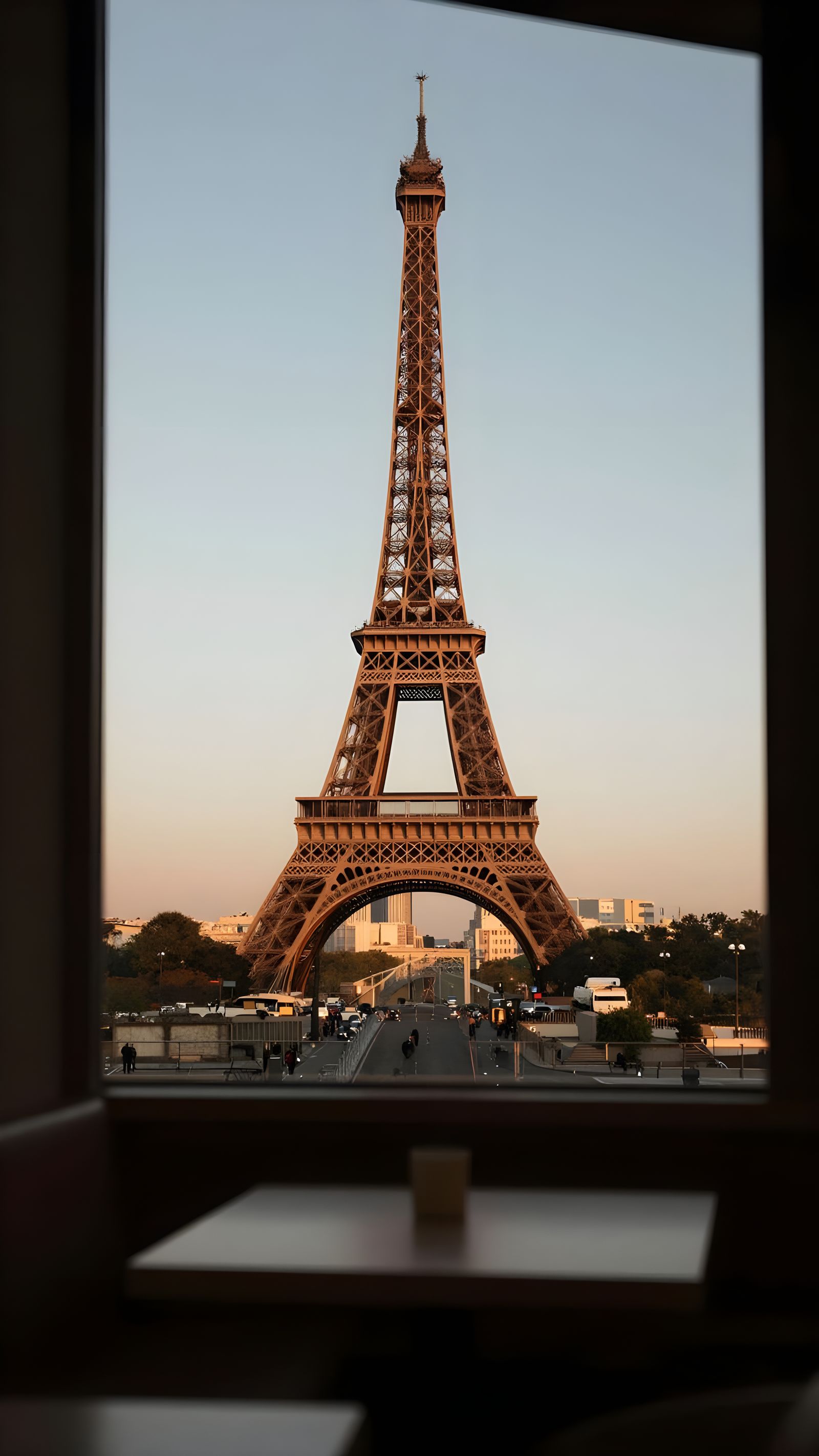 Eiffel Tower View from Cafe Window at Golden Hour