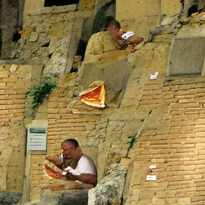 Man Enjoying Pizza in Italy