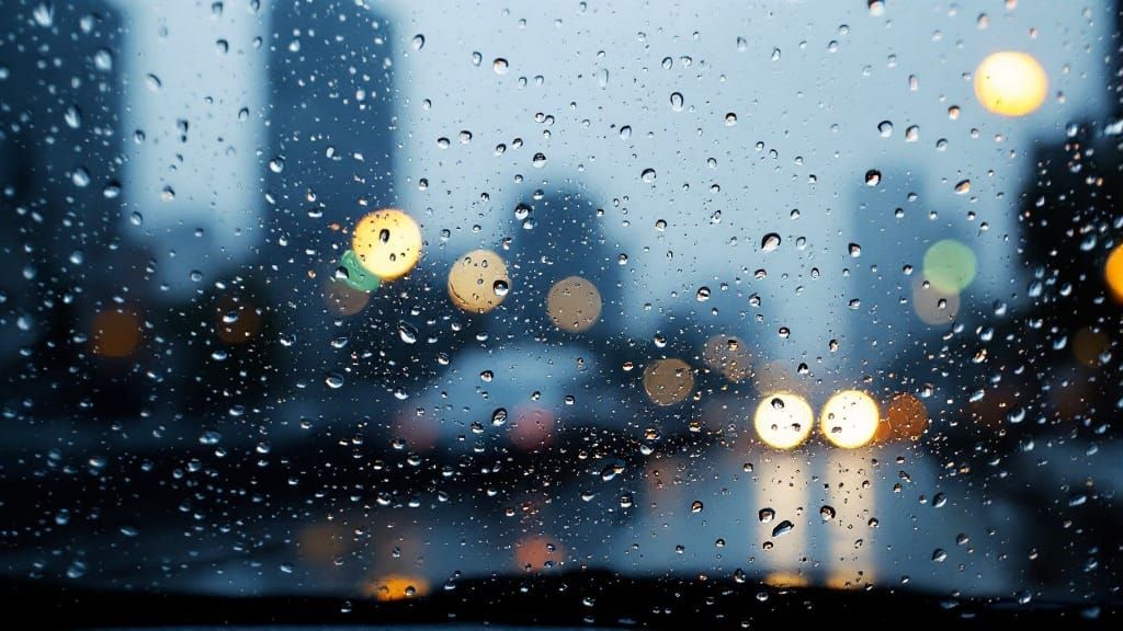 Rainy Cityscape Refracted through Water Droplets