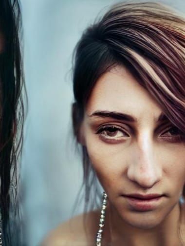 Beautiful Woman in Glass Dress Under Dazzling Night Sky