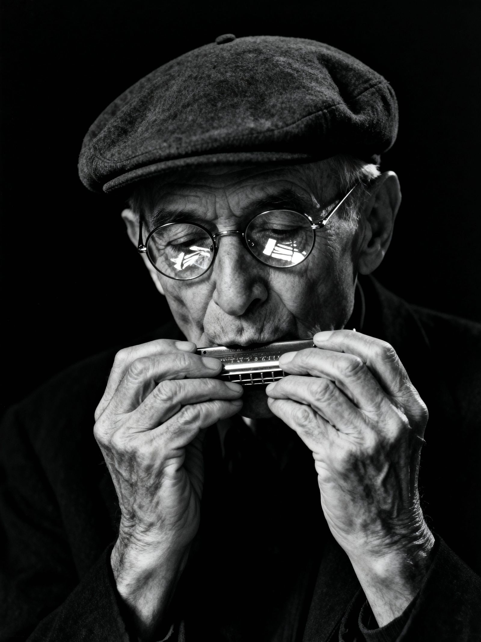 Fine Art Portrait of Elderly Man Playing Harmonica