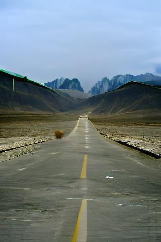 Empty Road Leading to Distant Mountains