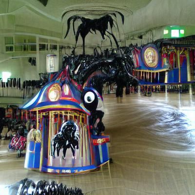 Giant Black Carousel Monster in Cavernous Hall