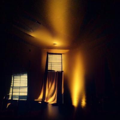 Warm Golden Light in a Dark Room