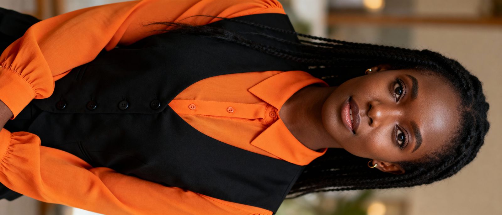 Stylish Black Woman in Orange and Black Attire