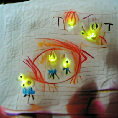 Child's Drawing: Tiny Tots with Glowing Eyes