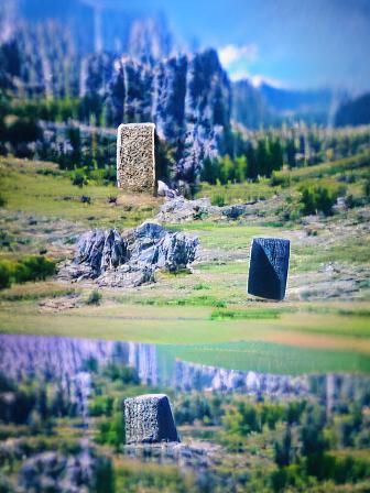 Ancient Runestone Monolith in Mountainous Landscape