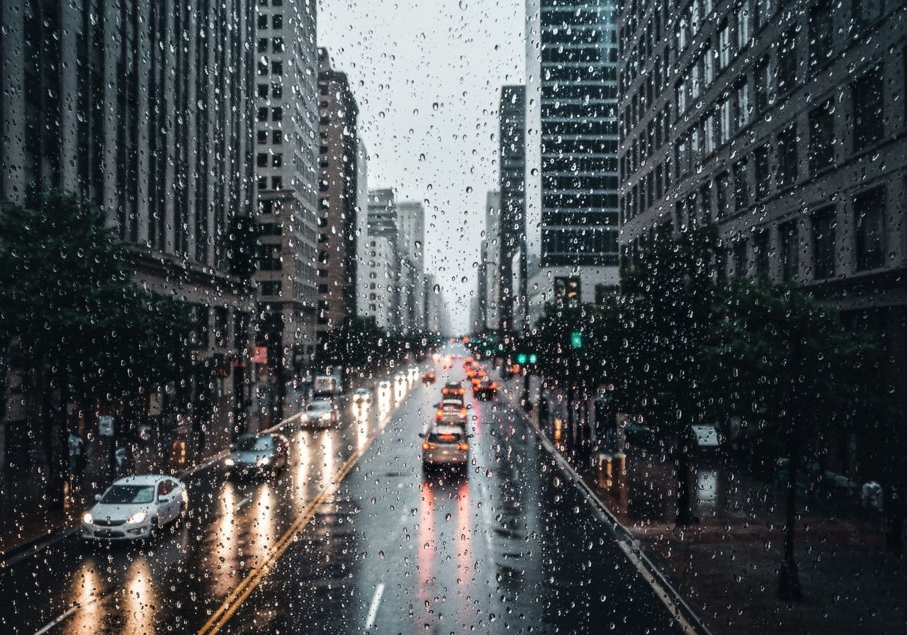 Moody Rainy City Street View Through Window