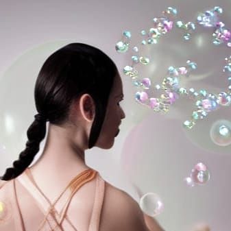 Magical Woman in a Dreamlike World with Soap Bubbles and Pis...