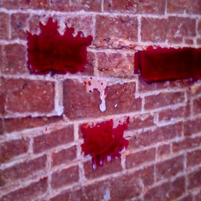 blood spill on the wall bricks