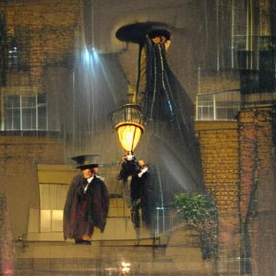 Victorian Men Under Gas Lamp in Rainy London