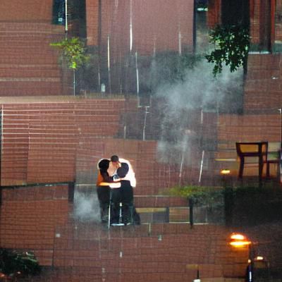 Romantic Couple Kissing in the Rain