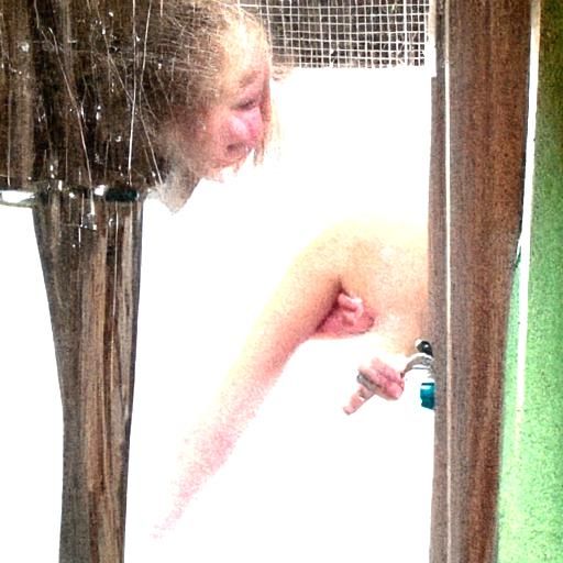 Person Shaving Armpit in Shower