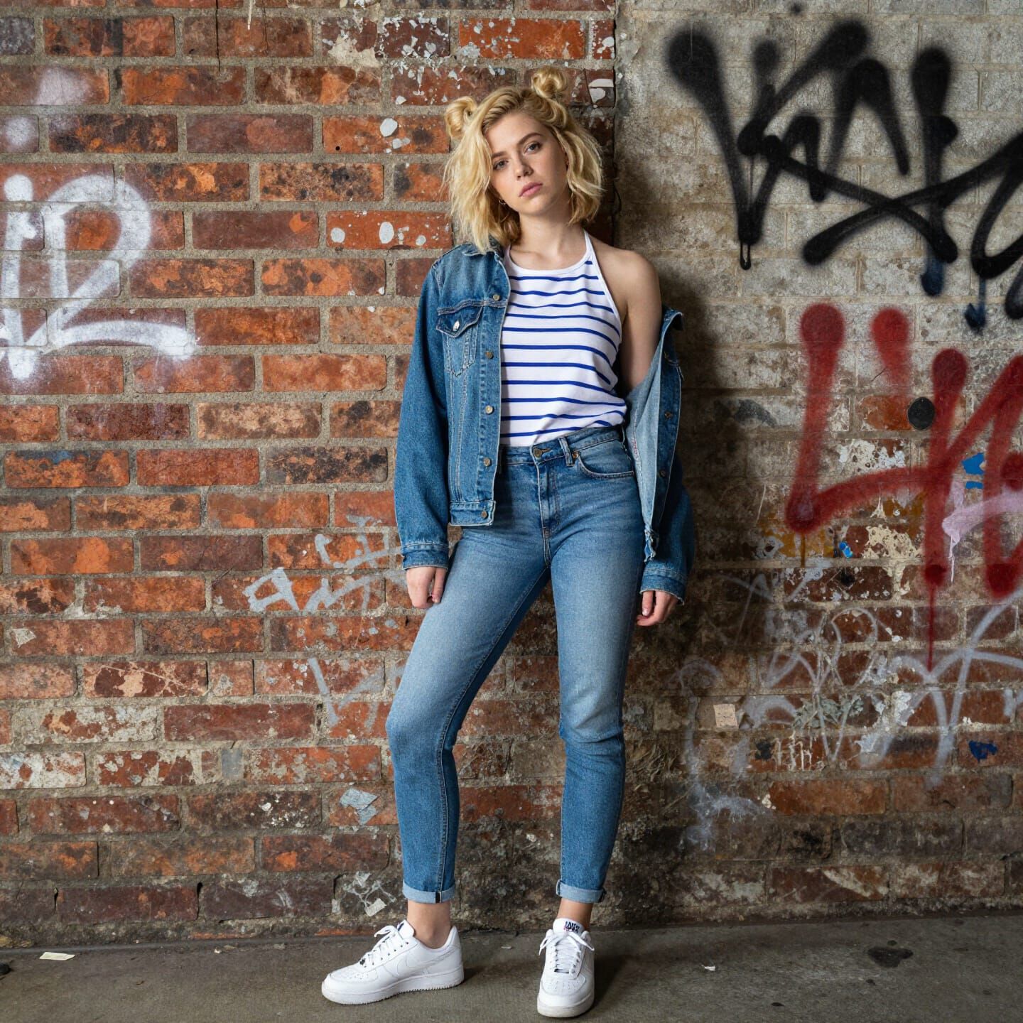Young Woman Against Graffiti Wall, Bored Expression