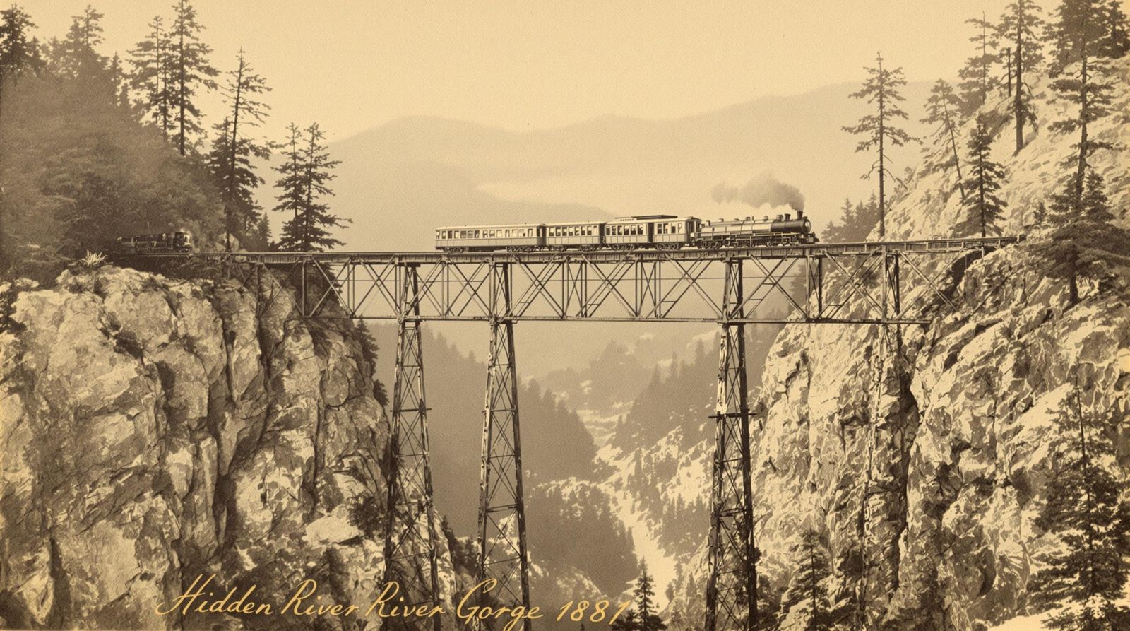 Sepia Photo of Steam Train on Mountain Trestle