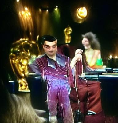 Mr. Bean wearing a velvet disco jumpsuit