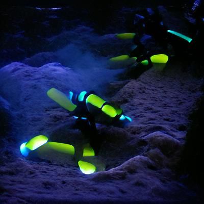 Bioluminescent Scuba Diver Exploring Coral Reef