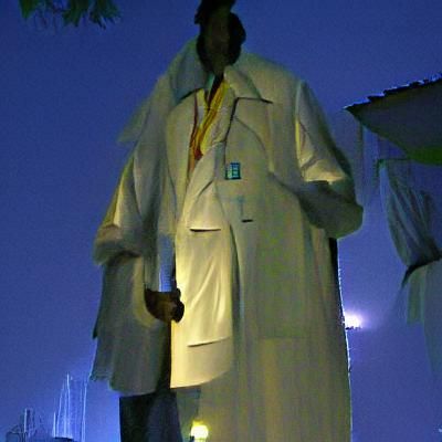 Night Scene: Tall Man in White Lab Coat