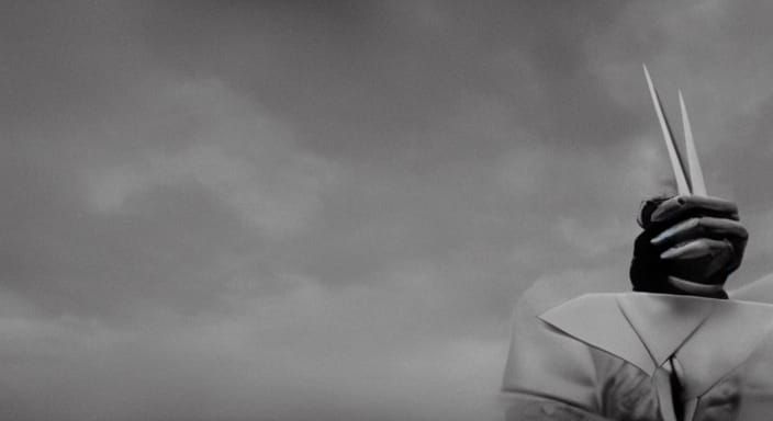 Dramatic Figure in Sharp Suit: Cinematic Film Still