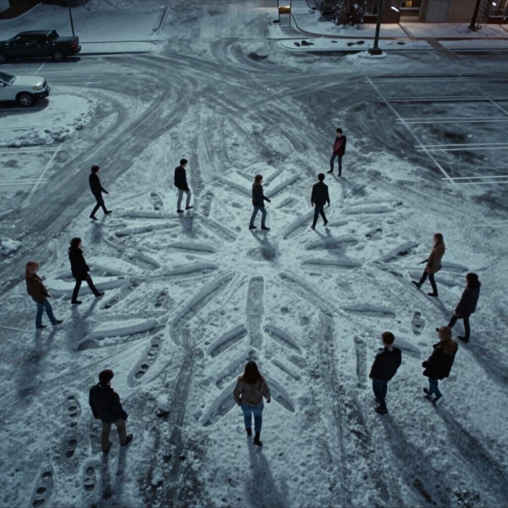 Snowy Parking Lot Snowflake Art by College Students