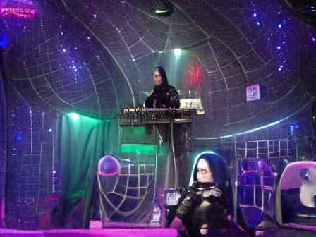 Gothic DJ in a BDSM Nightclub in Space