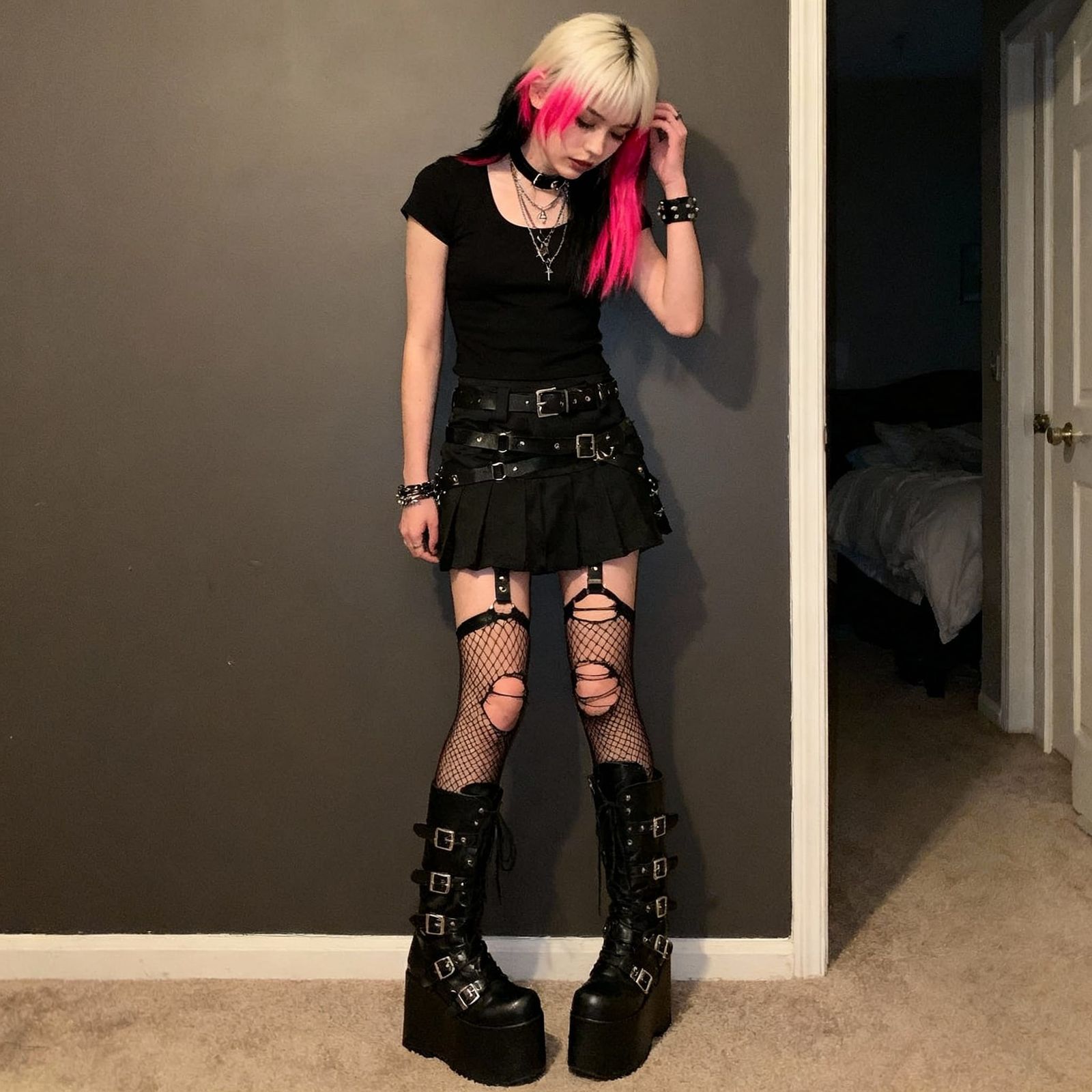 Goth Punk Woman with Split-Dyed Hair in Stylish Outfit