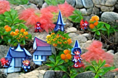 Enchanting Fairy Town Amidst Colorful Flora
