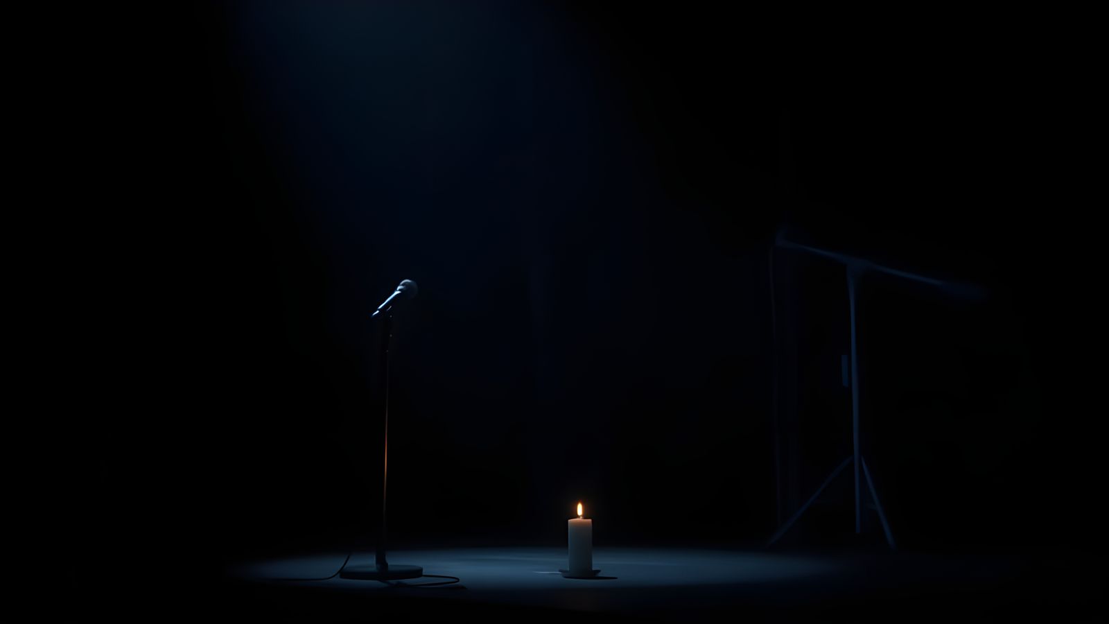 Microphone and Candle on Stage, Dramatic Lighting