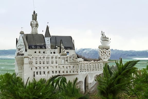 Elaborate Sandcastle Neuschwanstein on Beach in Photorealism...