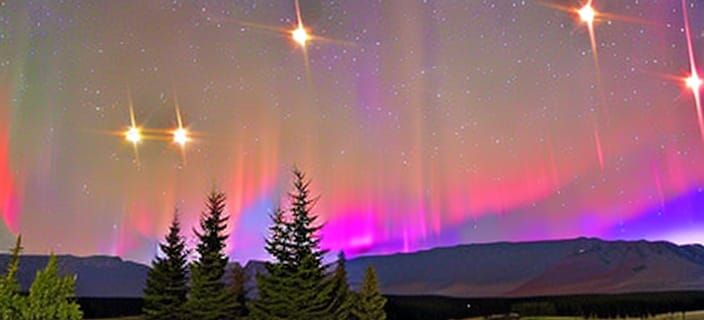 Night starry sky with brilliant purples, red and green auror...