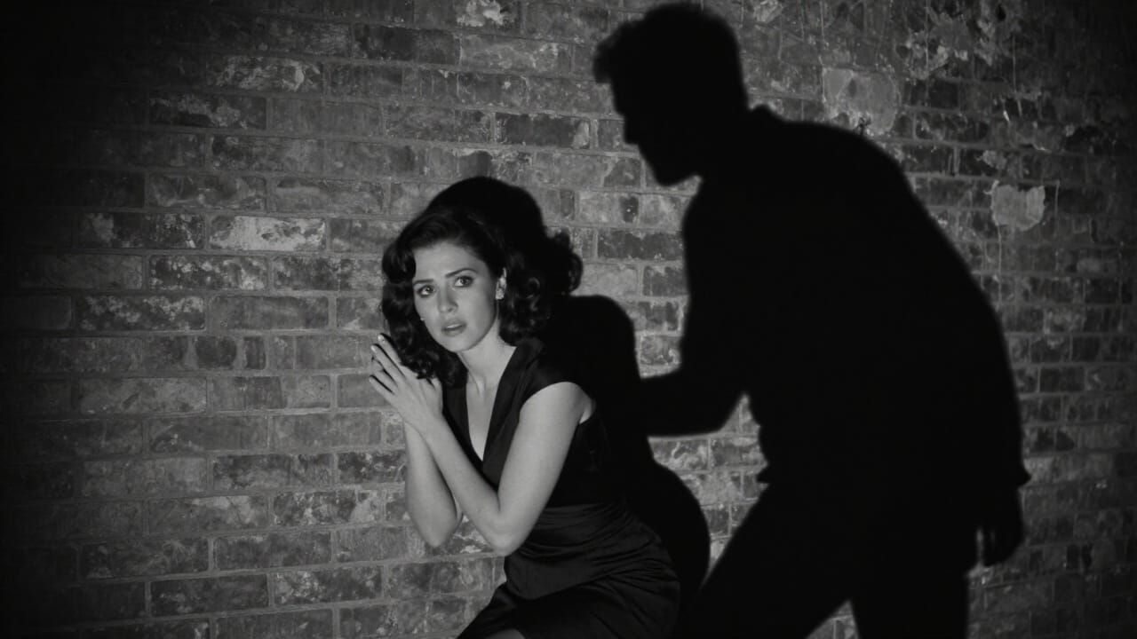 Woman Cowering from Shadow in Film Noir Style