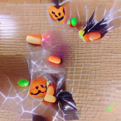 Child Witch with Pumpkin Basket at Halloween