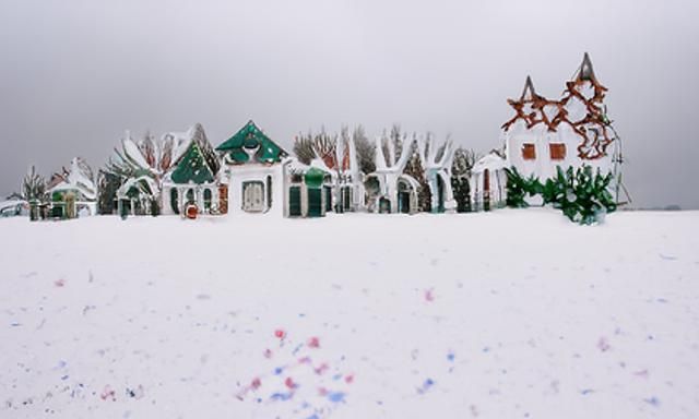 Christmas House in Snow with Twinkling Lights