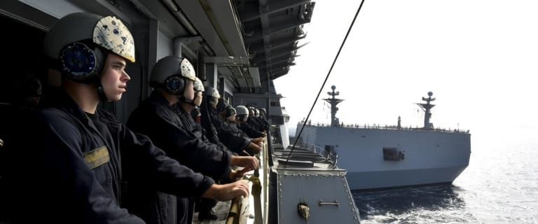 Naval Crew Rushing to Battle Stations