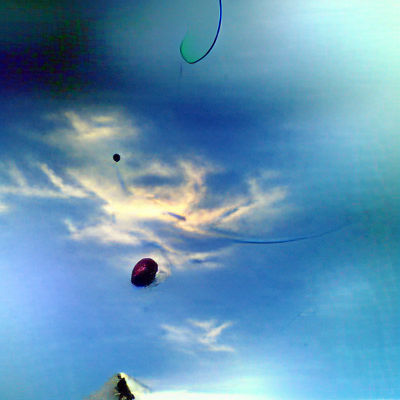 Colorful Balloon Floating in a Clear Sky