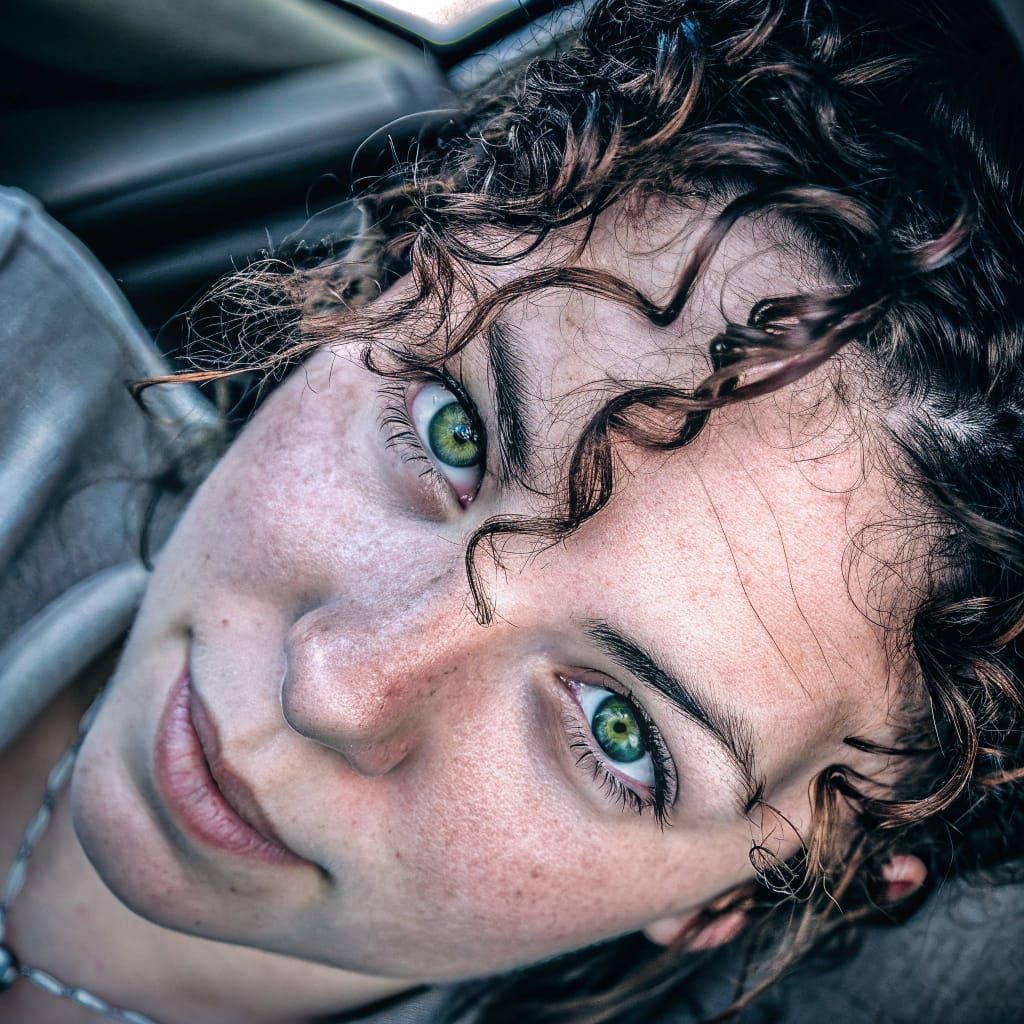 High Definition Portrait of a Green-Eyed Woman with Copper C...