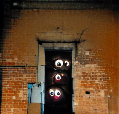 Nightmarish Eyes in Dark Doorway Horror Scene